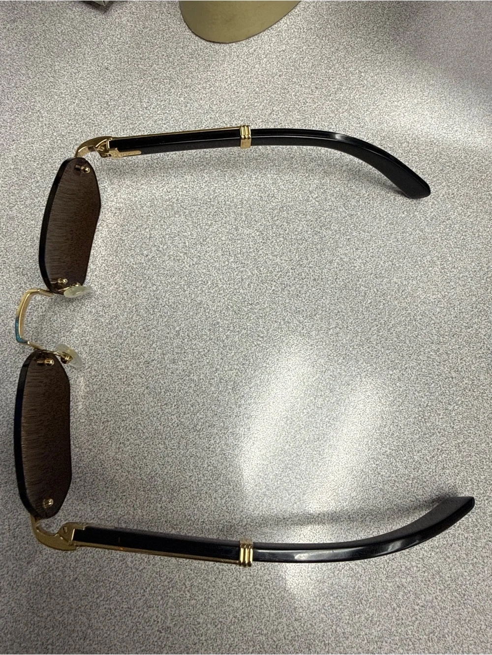 Cartier Gold Bridge Black Lens Rimless Sunglasses